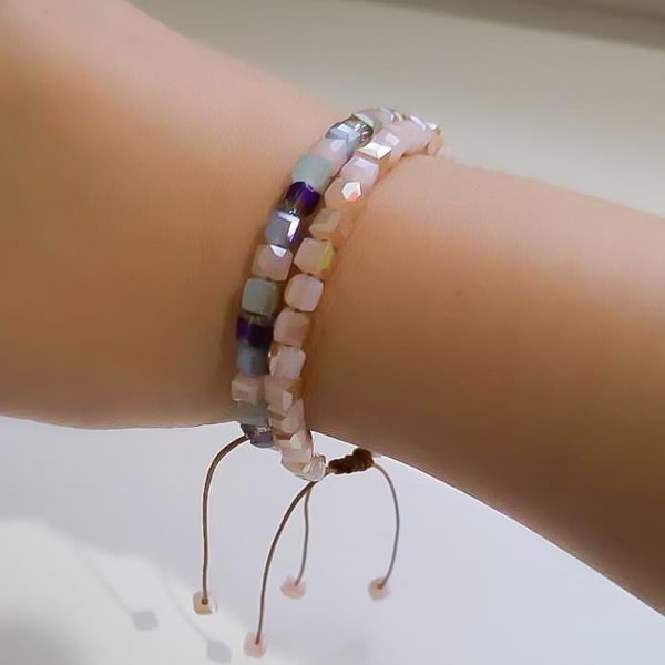 Woman wearing a powder pink square crystal bracelet
