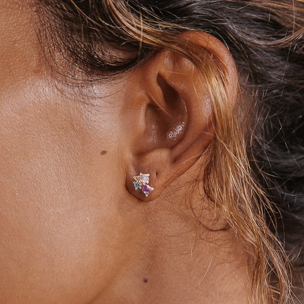 Woman wearing purple crystal cluster stud earrings