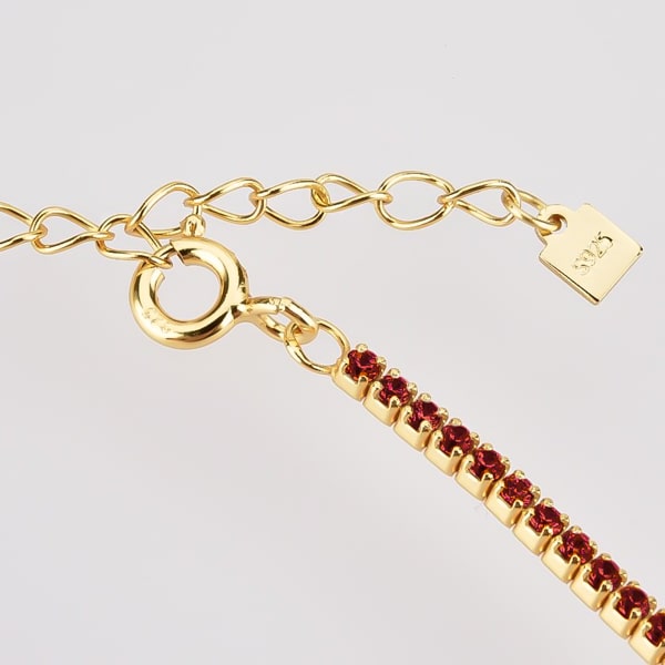 Details of the gold tennis choker necklace with red cubic zirconia stones