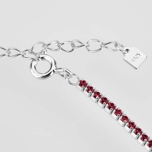 Details of the silver tennis choker necklace with red cubic zirconia stones