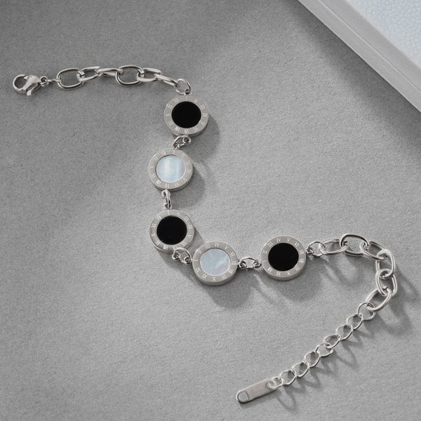 Silver Roman numeral chain bracelet with black and white mother of pearl round coins