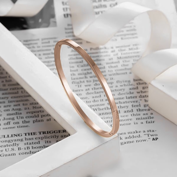 A 4mm rose gold bangle bracelet made of waterproof hypoallergenic stainless steel