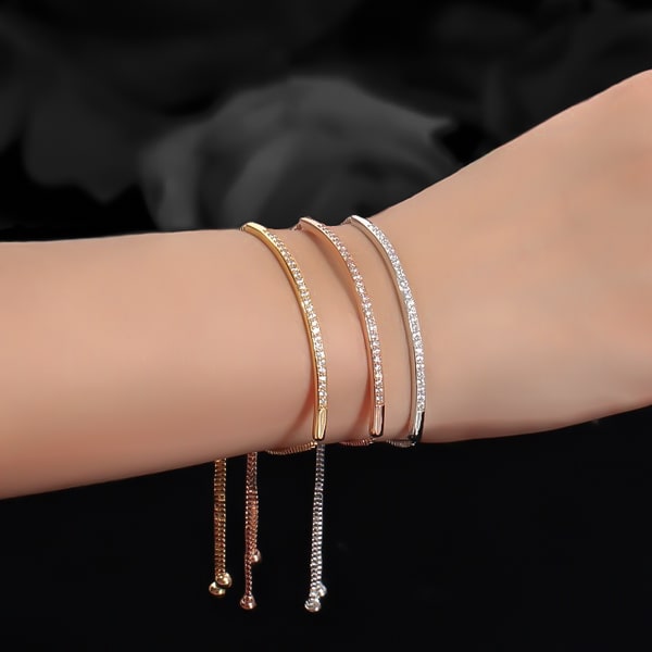Woman wearing a rose gold crystal bar bolo bracelet