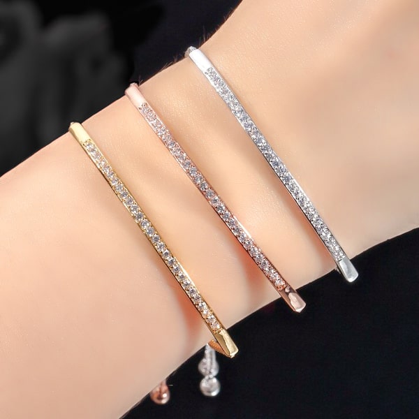 Woman wearing a rose gold crystal bar bracelet