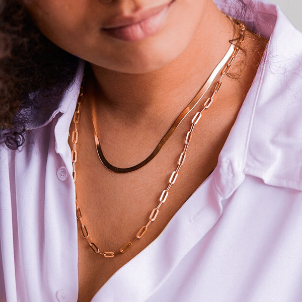 Rose gold paperclip chain necklace on woman