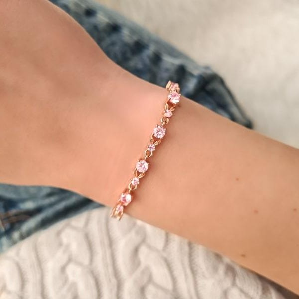 Woman wearing a rose gold pink crystal chain bracelet