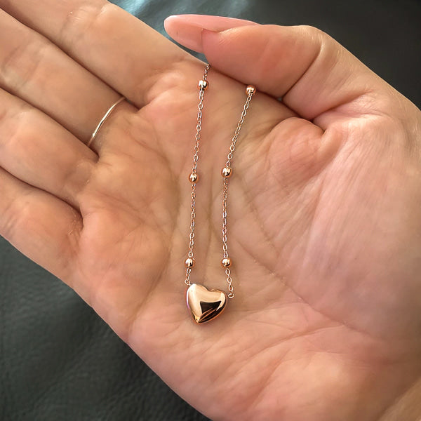 Rose gold beaded heart chain necklace display