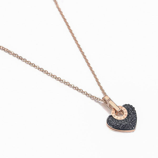 Black crystal heart pendant on a rose gold necklace display