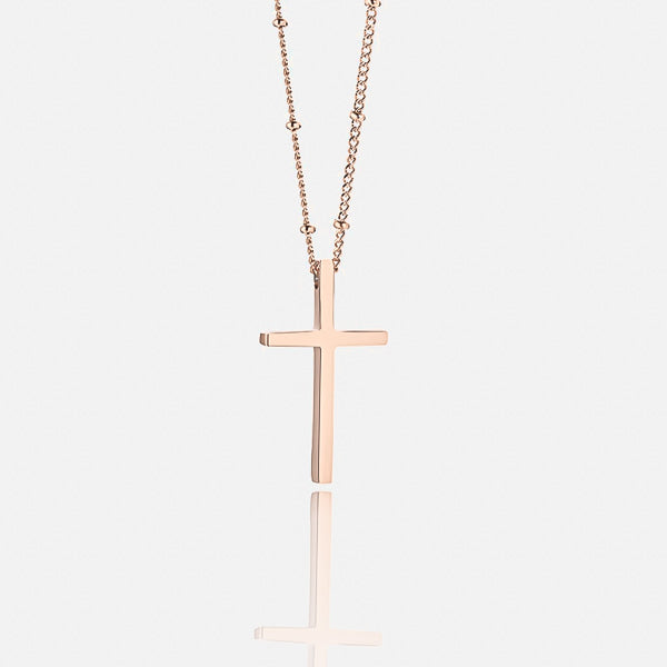 Rose gold cross necklace display