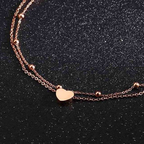 Rose gold layered beads and heart ankle bracelet close details
