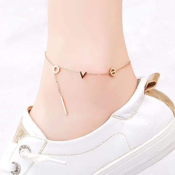 Rose gold love letters anklet displayed on an ankle