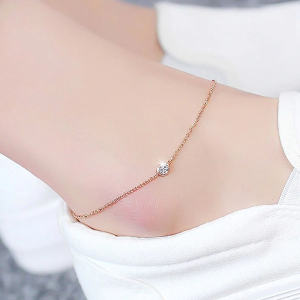 Rose gold simple crystal anklet dislplayed on an ankle