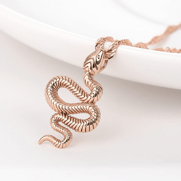 Close up of the rose gold snake necklace