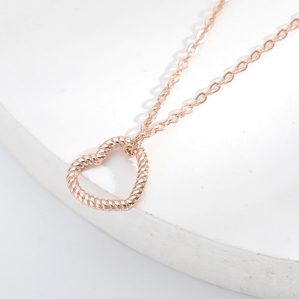 Rose gold twisted open heart pendant necklace display