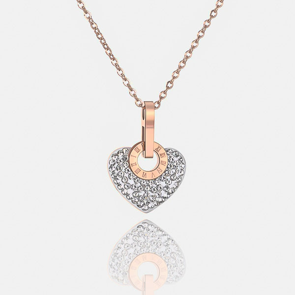 White crystal heart pendant on a rose gold necklace details