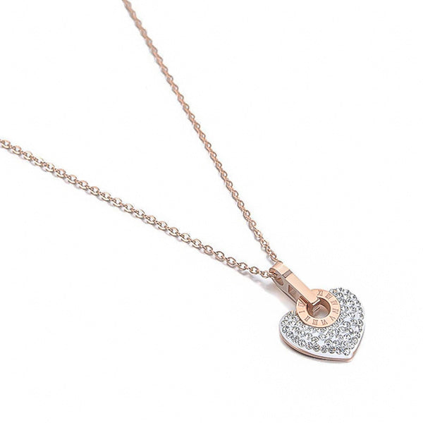 White crystal heart pendant on a rose gold necklace display