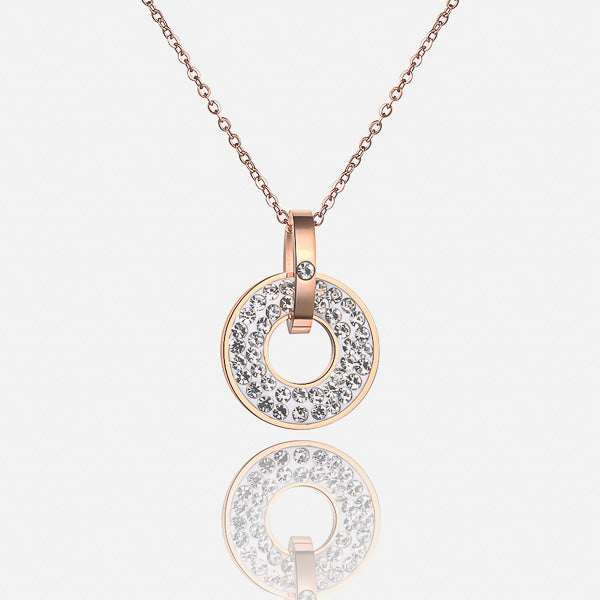 White crystal ring pendant on a rose gold necklace details