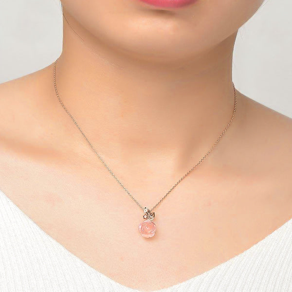 Rose Quartz flower pendant on a rose gold vermeil necklace displayed on a woman's neck