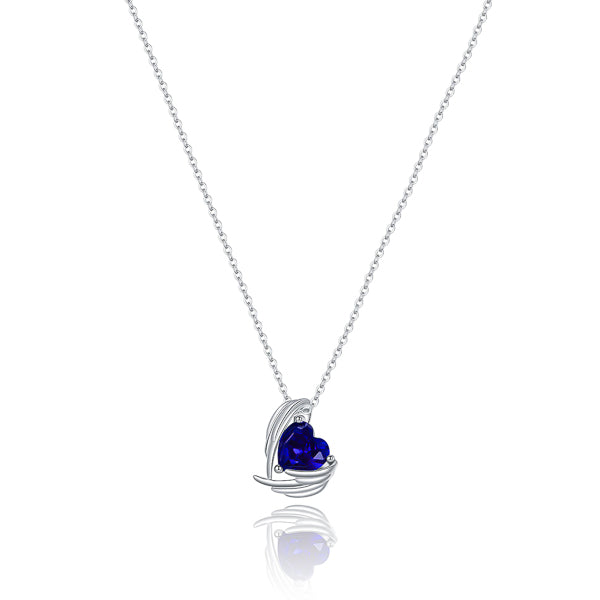 Sapphire blue crystal heart and angel wings pendant on a silver chain
