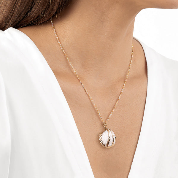 Woman wearing scallop shell necklace