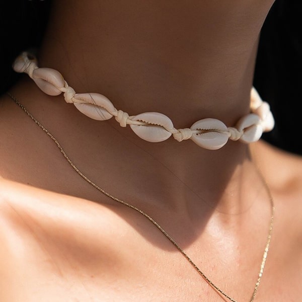Woman wearing a shell necklace choker
