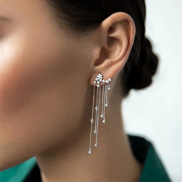 Woman wearing shooting star chandelier earrings