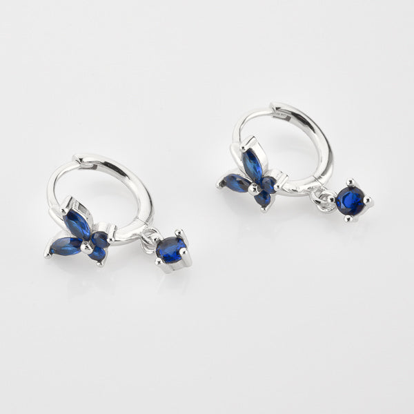 Silver and blue crystal butterfly huggie hoop earrings details