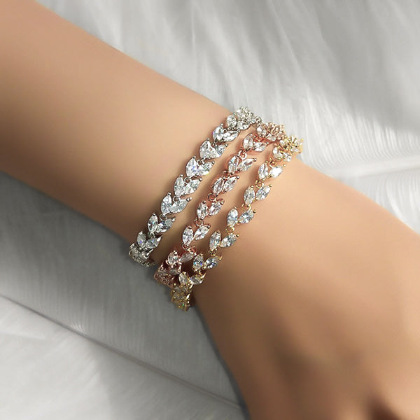 Woman wearing a silver crystal leaf bracelet on her wrist
