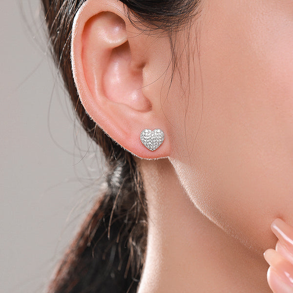 Silver pavé crystal heart stud earrings on model