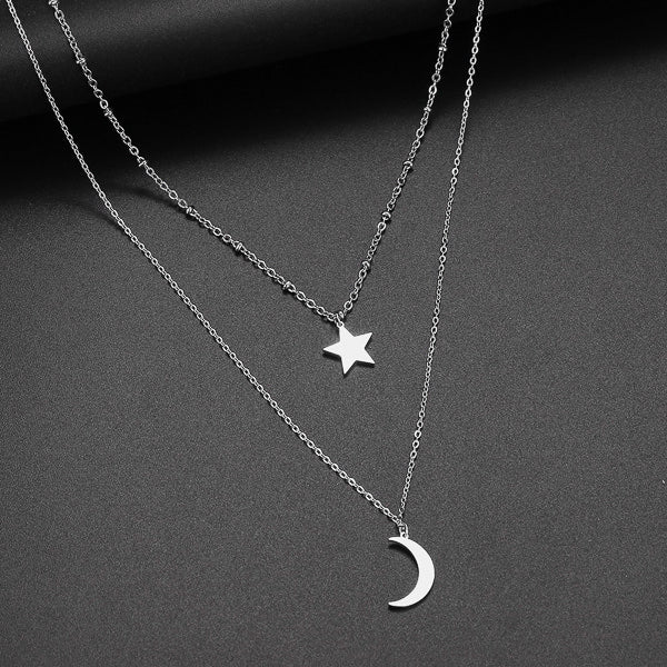 Silver layered star and moon necklace details