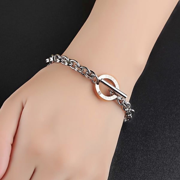 Silver & rose gold love chain bracelet on a woman's wrist
