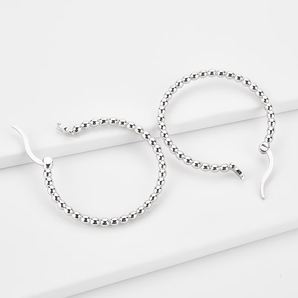 Silver beaded hoop earrings details