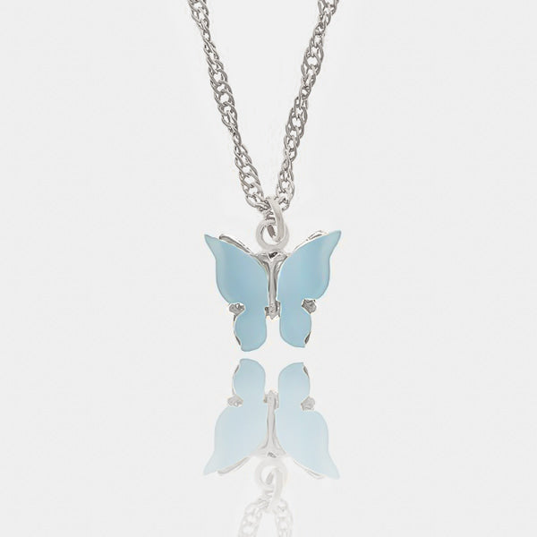 Blue butterfly pendant on a silver necklace details