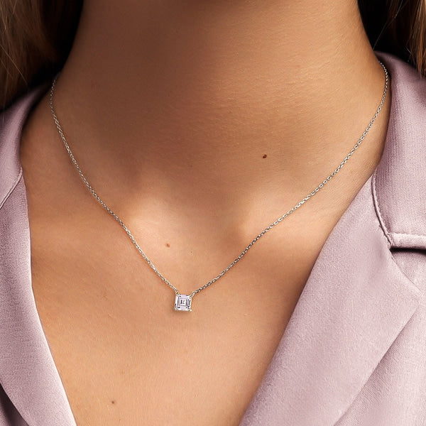 Woman wearing a silver square carre cut crystal necklace