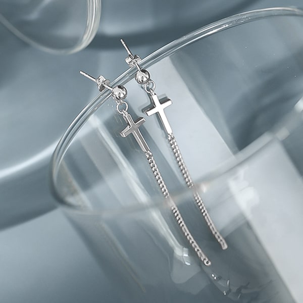 Silver cross drop chain earrings detail