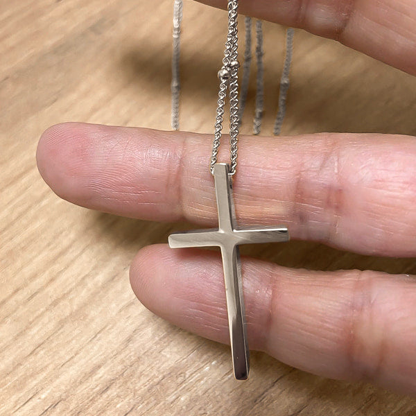 Silver cross necklace details