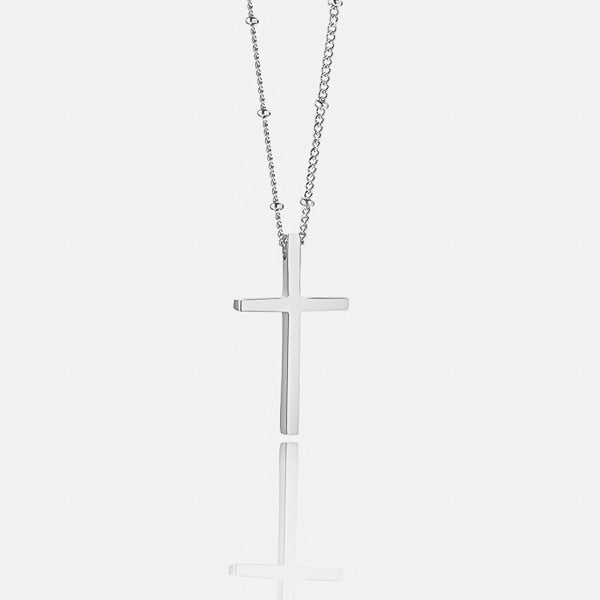 Silver cross necklace display