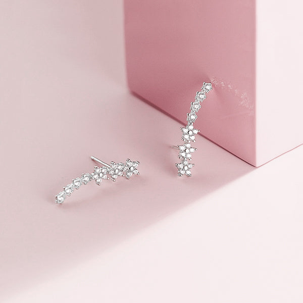 Silver crystal flower climber earrings details