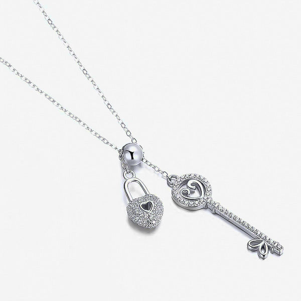 Silver key and lock heart necklace with crystal trim display