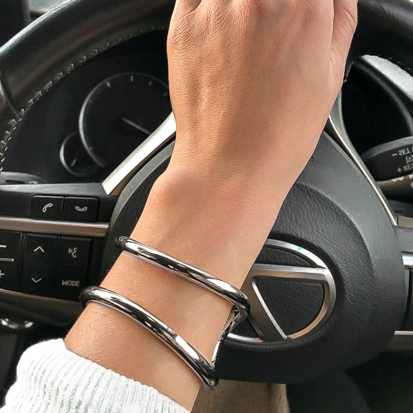 Silver divine cuff bracelet on a woman's wrist