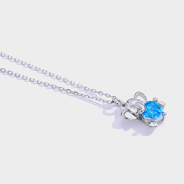 Silver elephant and blue crystal heart pendant necklace display