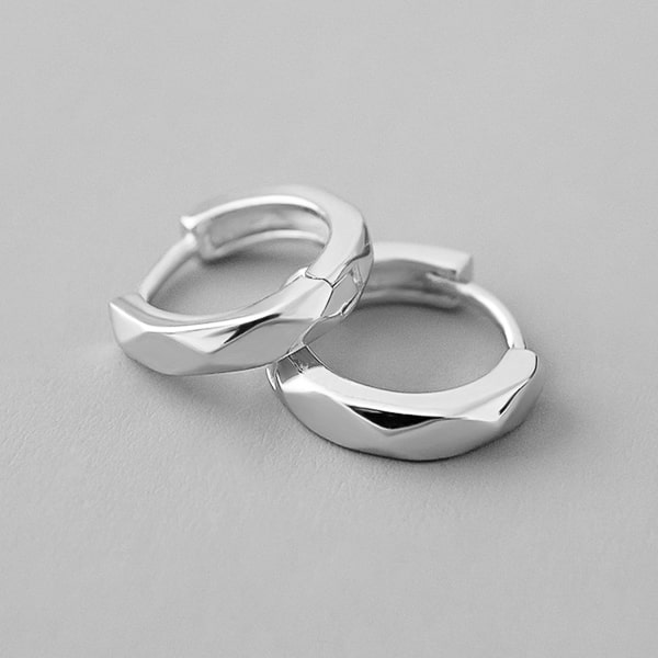 Silver faceted huggie hoop earrings details