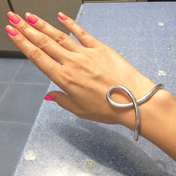Silver goddess cuff bracelet displayed on woman's wrist
