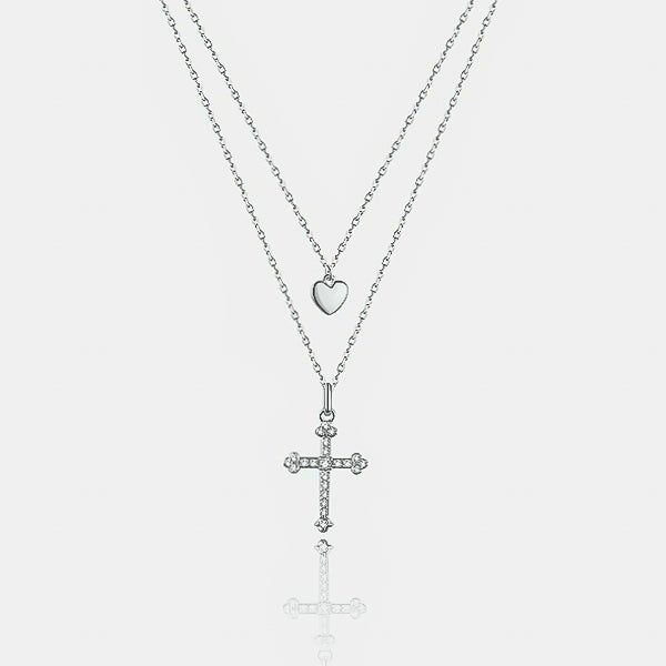 Details of the silver layered heart and cross necklace
