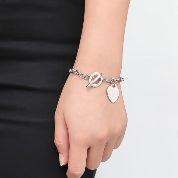 Silver love heart chain bracelet on a woman's wrist