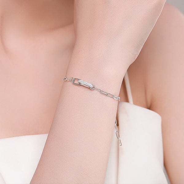 Silver luxury link chain bracelet on woman's wrist