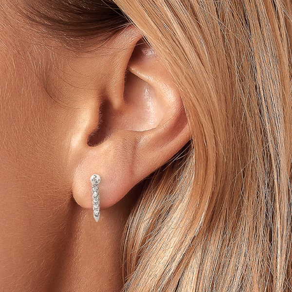 Model wearing silver mini crystal drop bar earrings