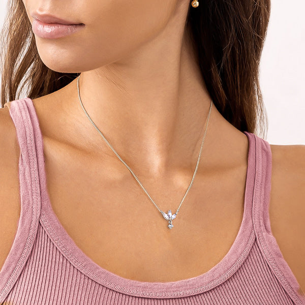 Woman wearing silver mini lotus necklace