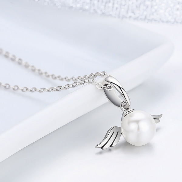 Silver necklace with a pendant displaying a pearl with angel wings details
