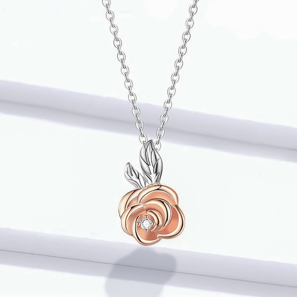 Silver necklace with a rose gold rose flower pendant details